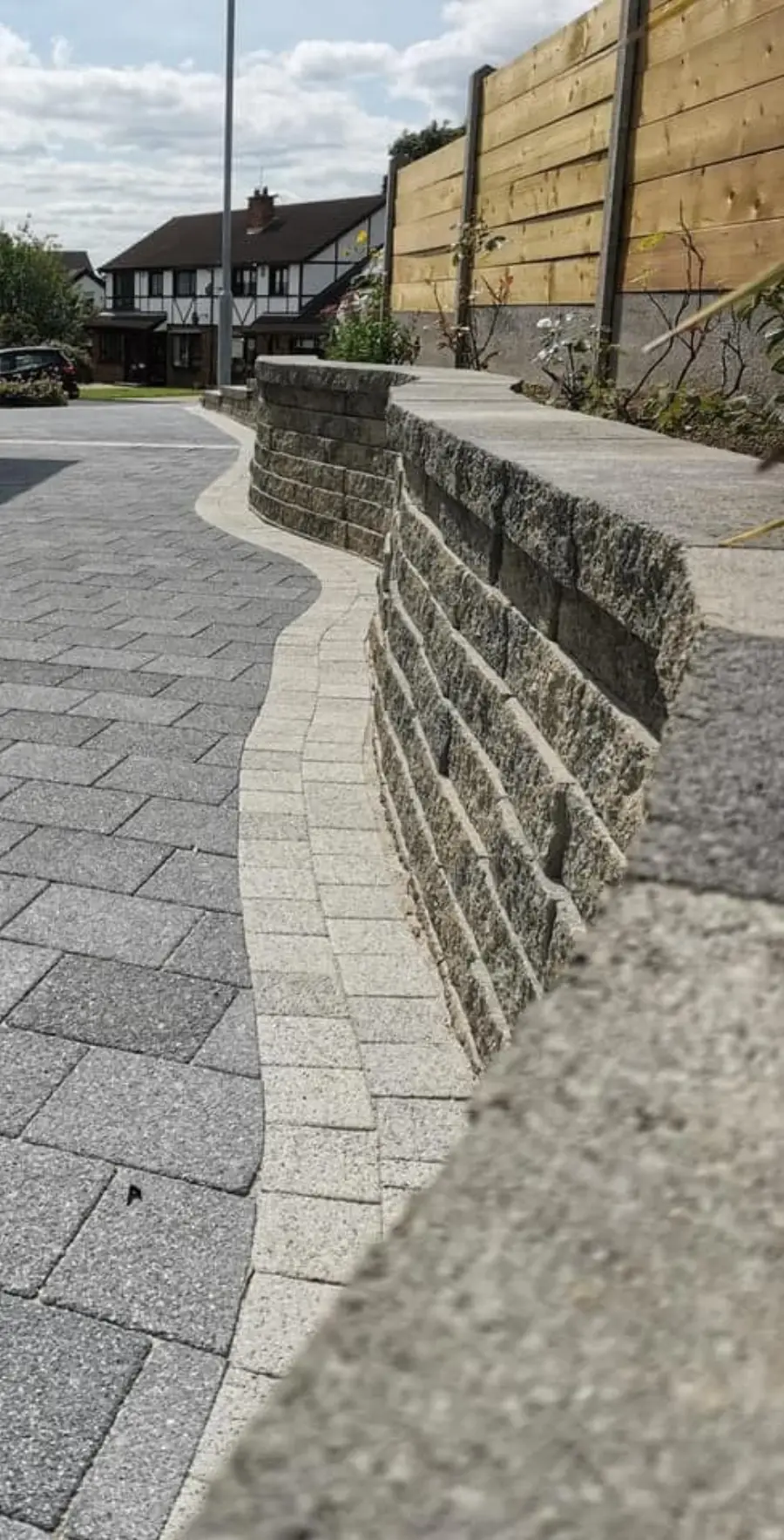 Curved slate walling and block paving detail